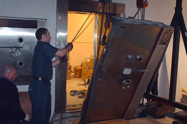 Safe Movers Dismantling Large Safe Door